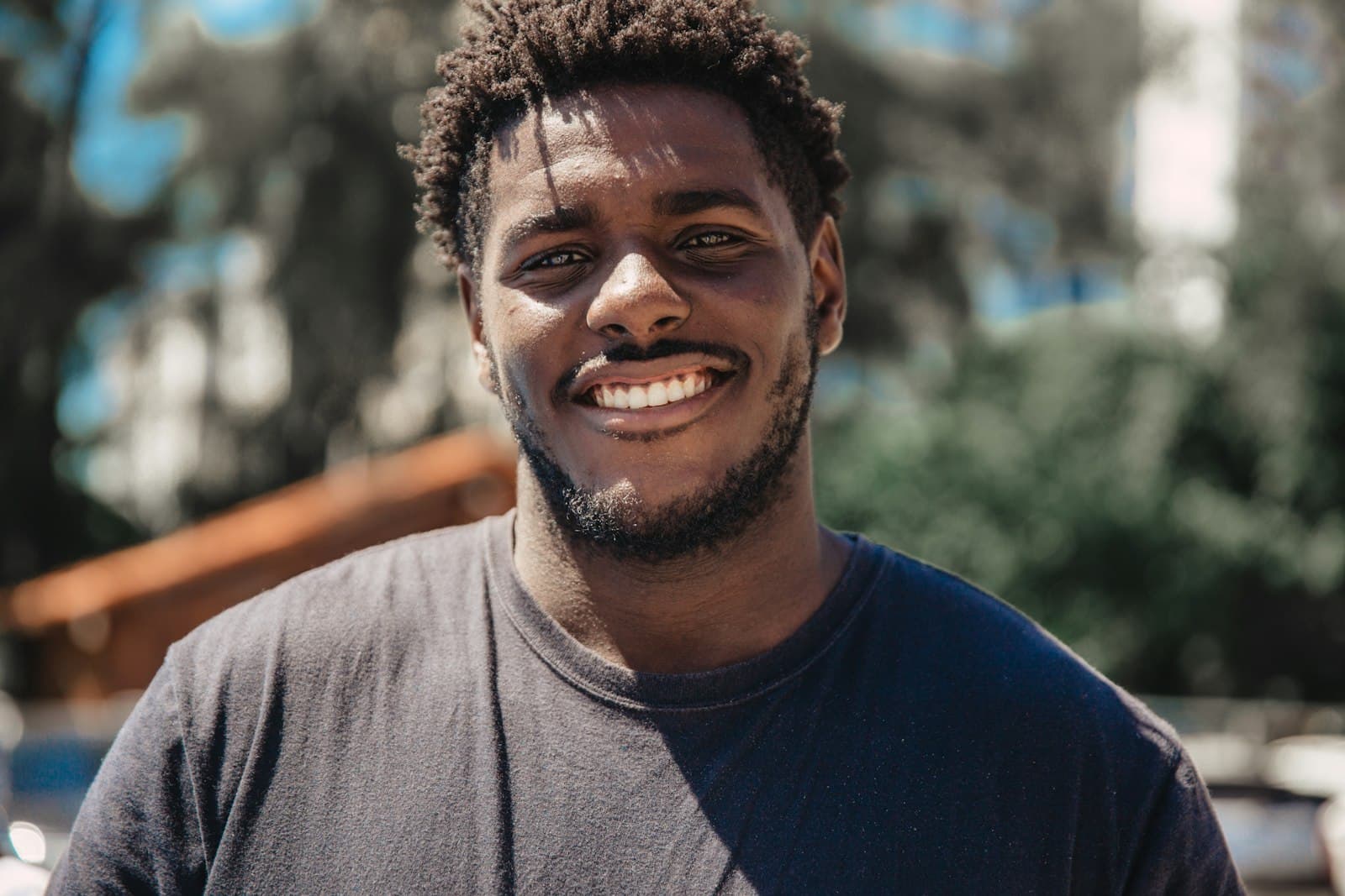 Young African man smiling with quiet confidence and hope