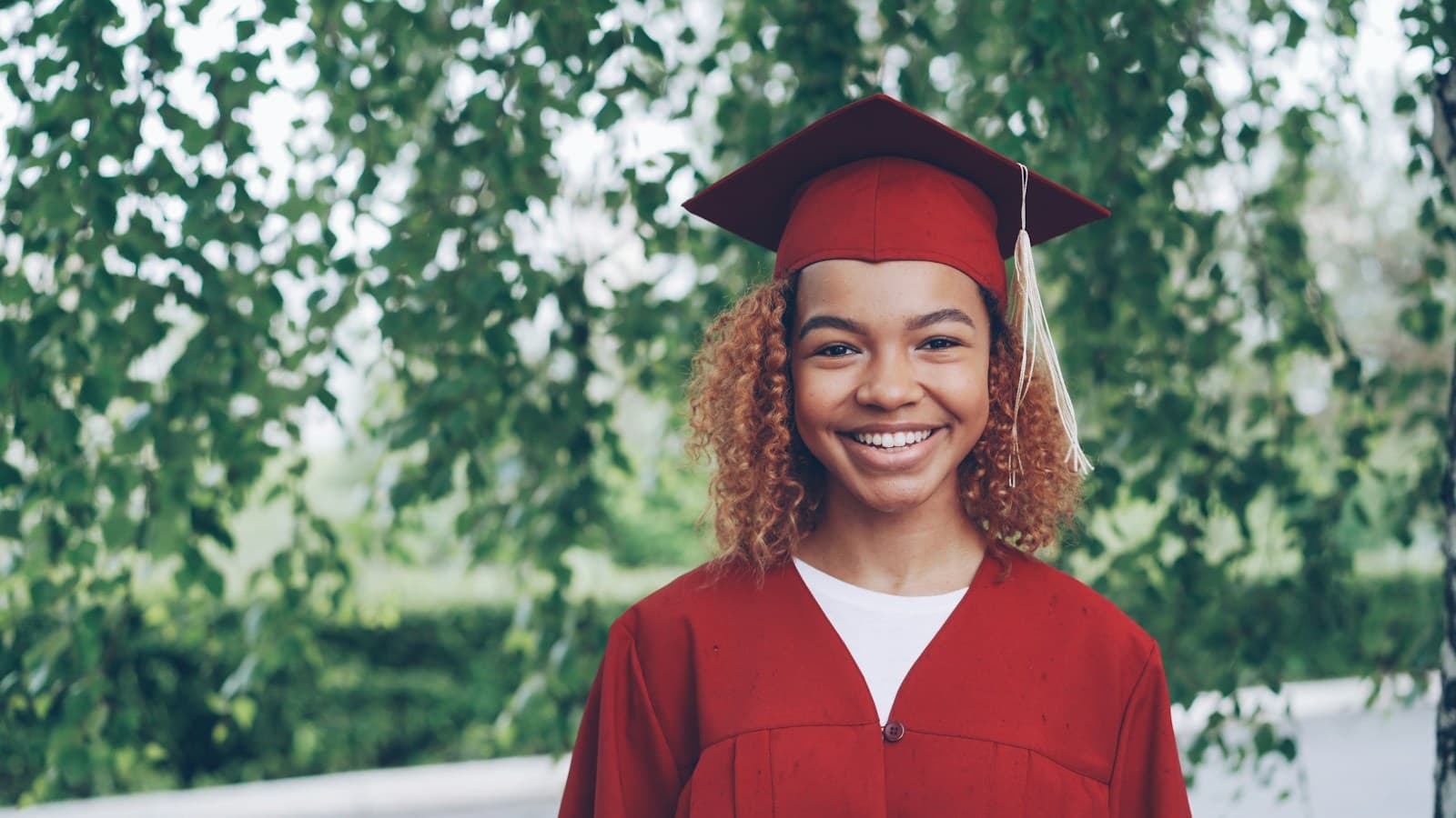 Young African woman celebrating educational success